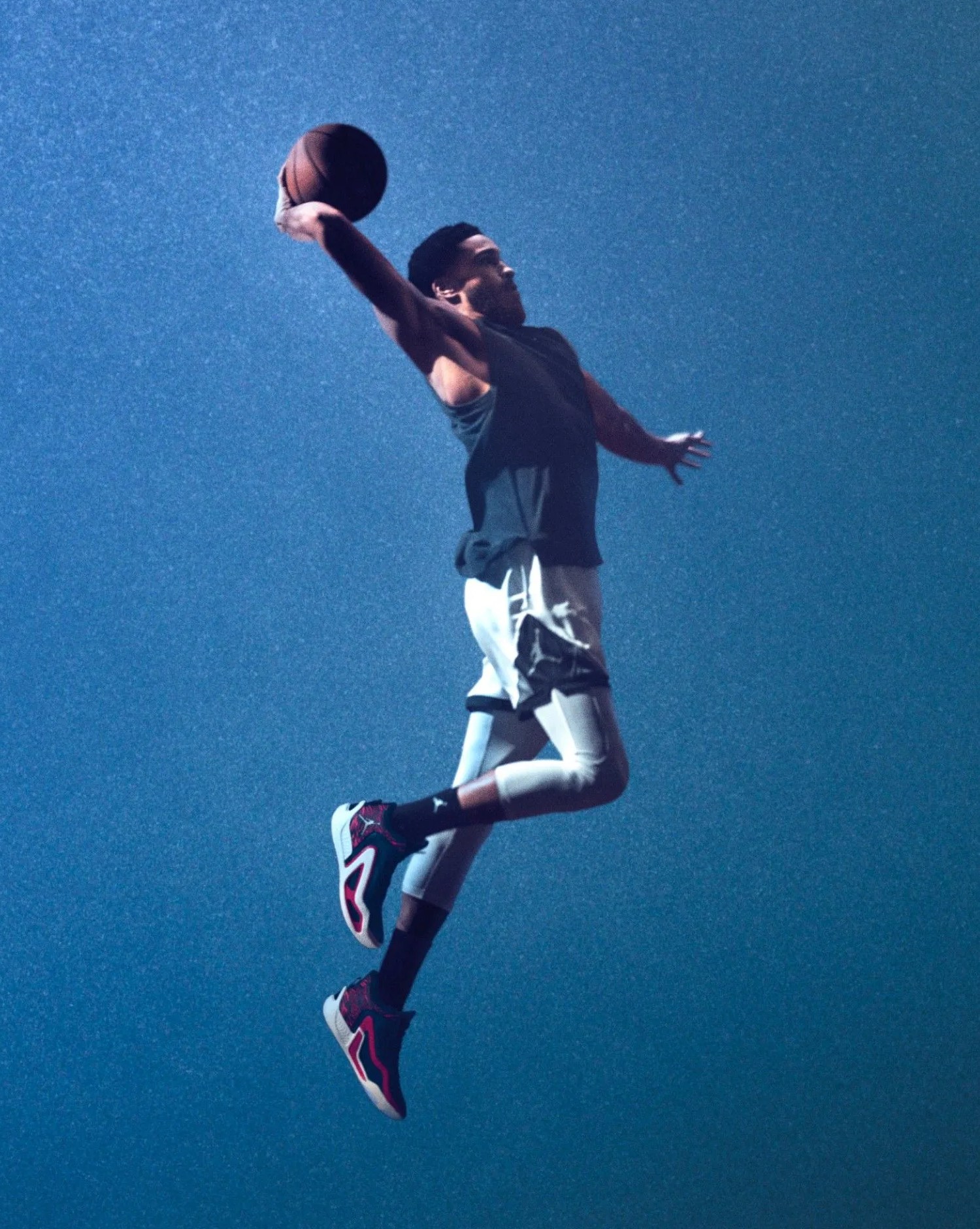 jordan brand dunking wearing the tatum 1 sneakers