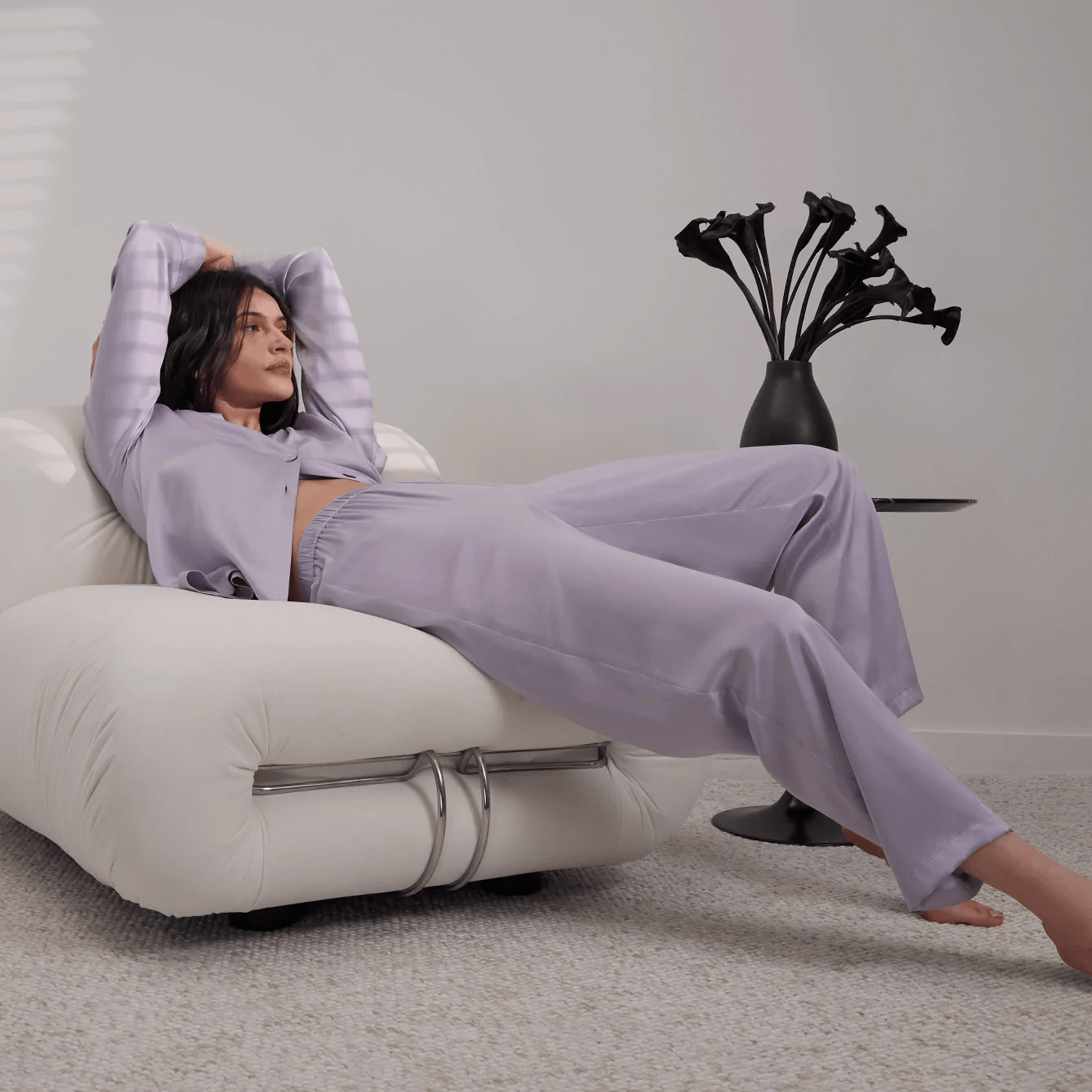 person lounging in silk sleepwear set