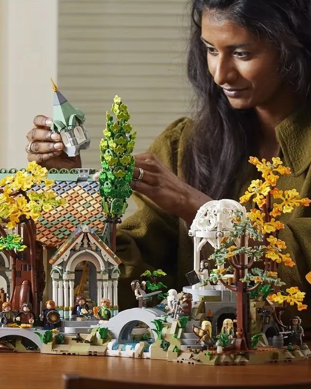 woman building the lord of the rings rivendell lego set