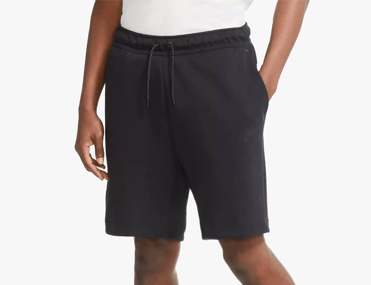 a man wearing black nike shorts