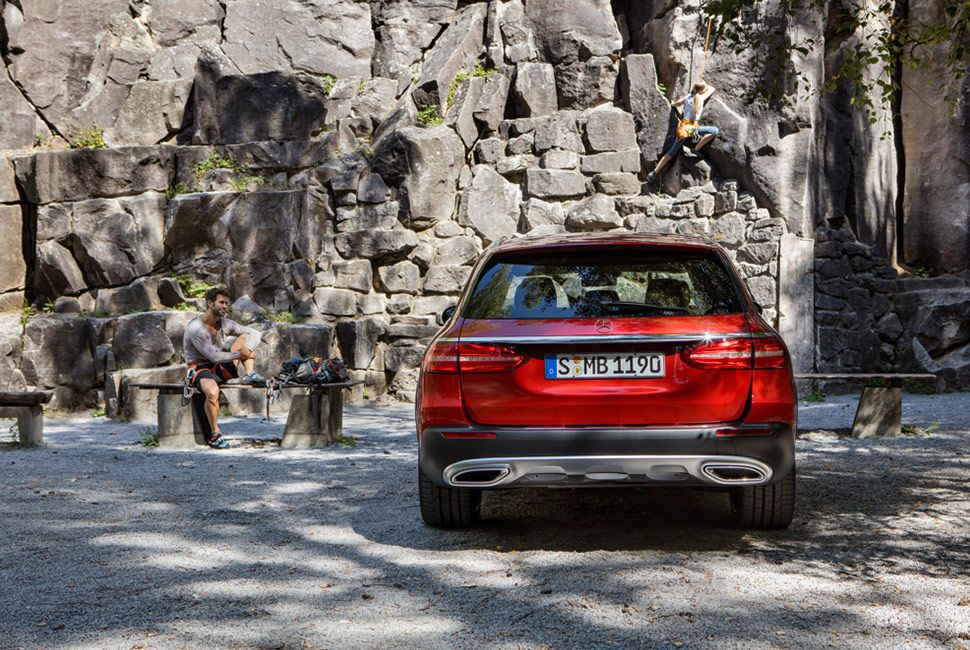 mercedes e class all terrain parked in front of a rocky wall