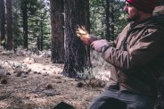 mark d ambrosio in the woods making fire