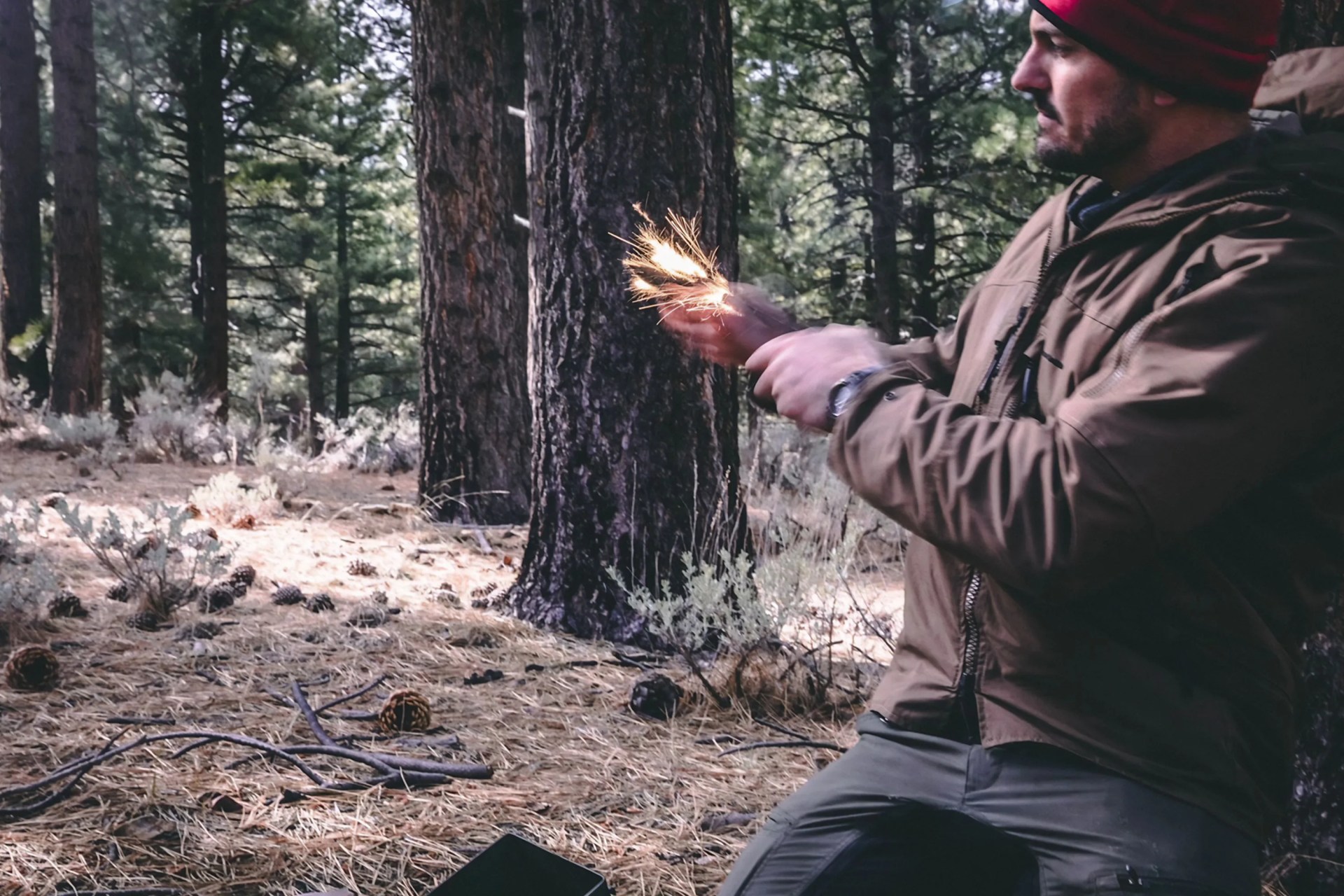 mark d ambrosio in the woods making fire