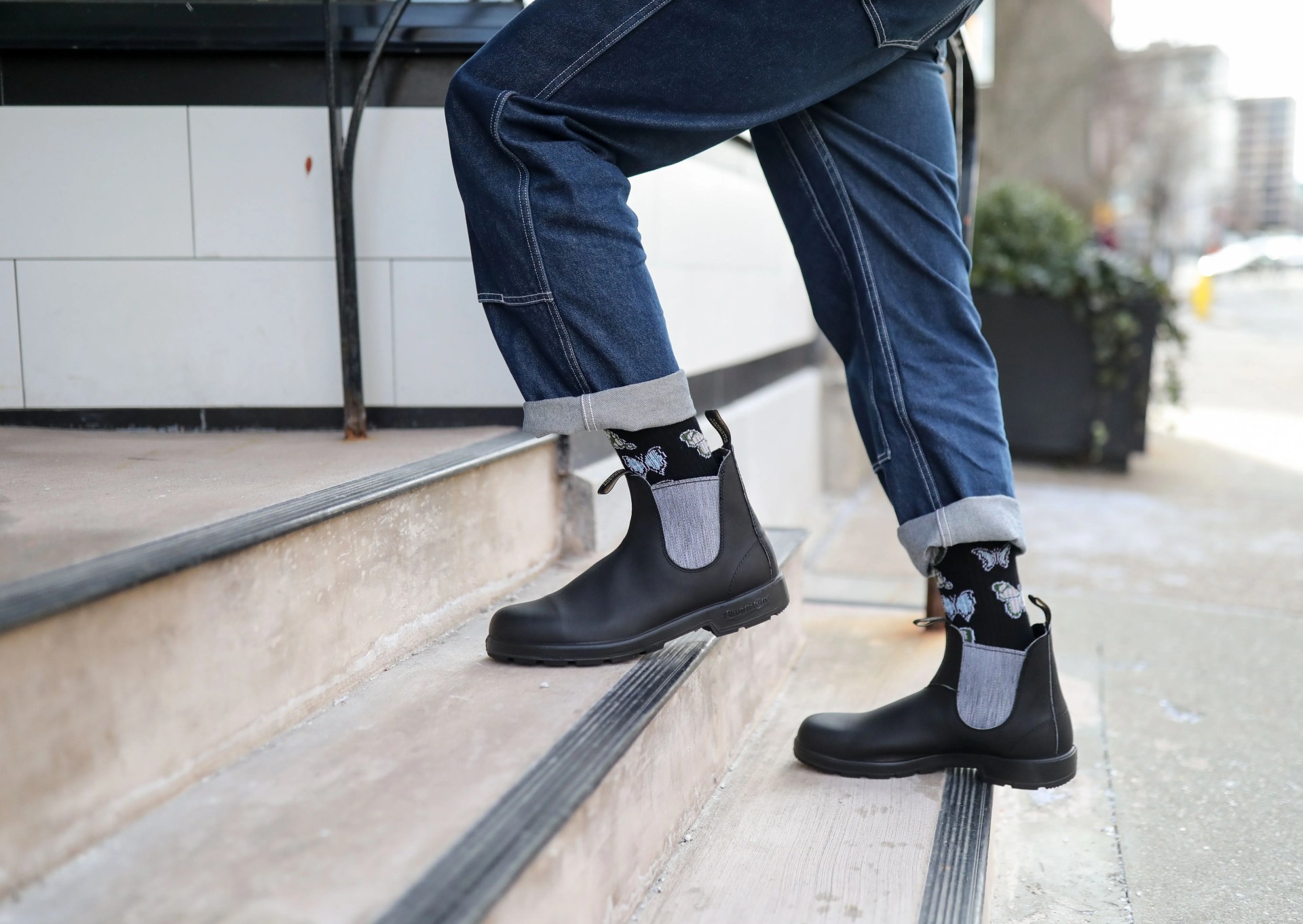 person wearing bluestone 1914 men's original chelsea boots in black and grey