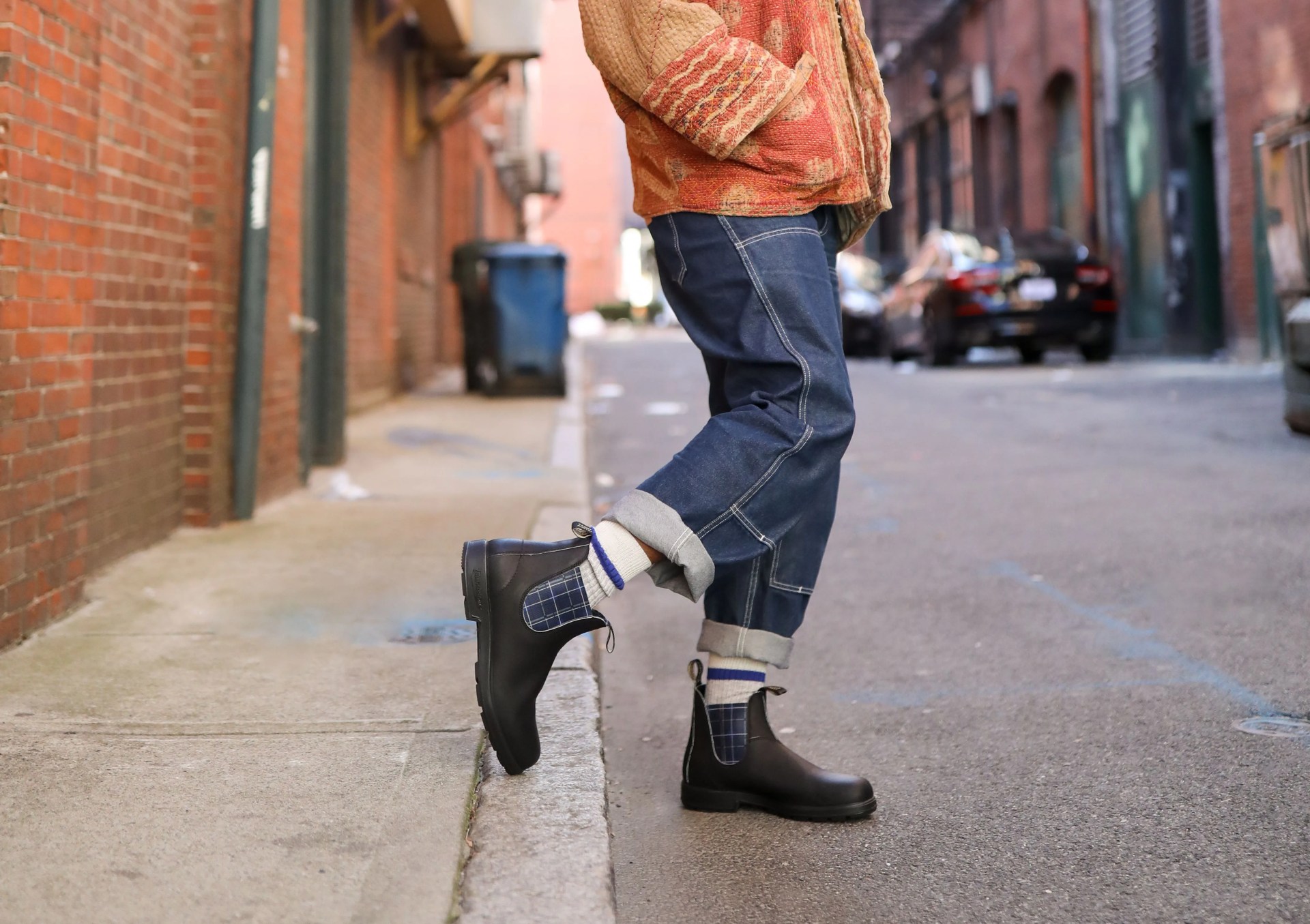 man wearing blundstone 2102 men's originals chelsea boots in black and plaid