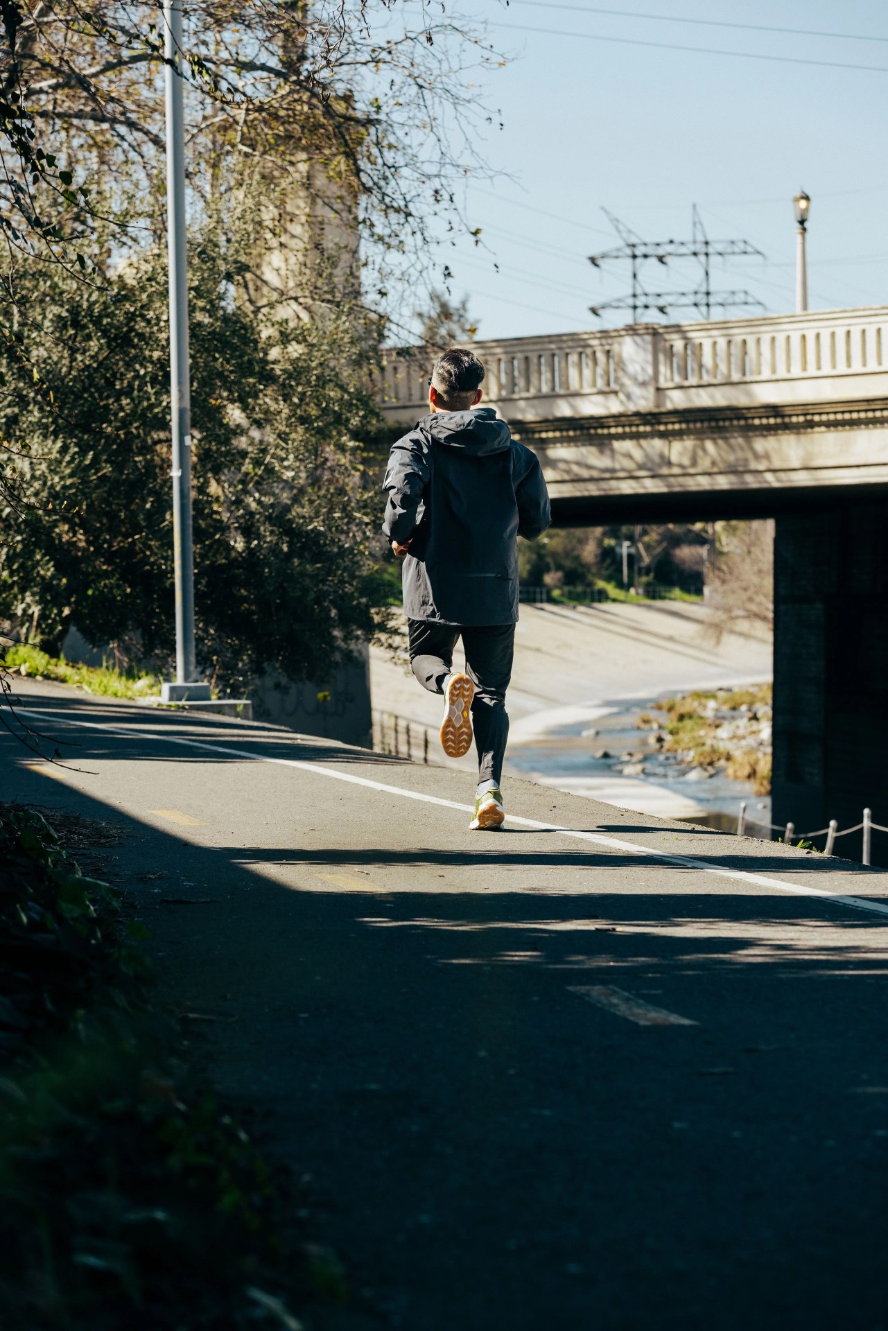 ja tecson jogging wearing hoka transport sneakers