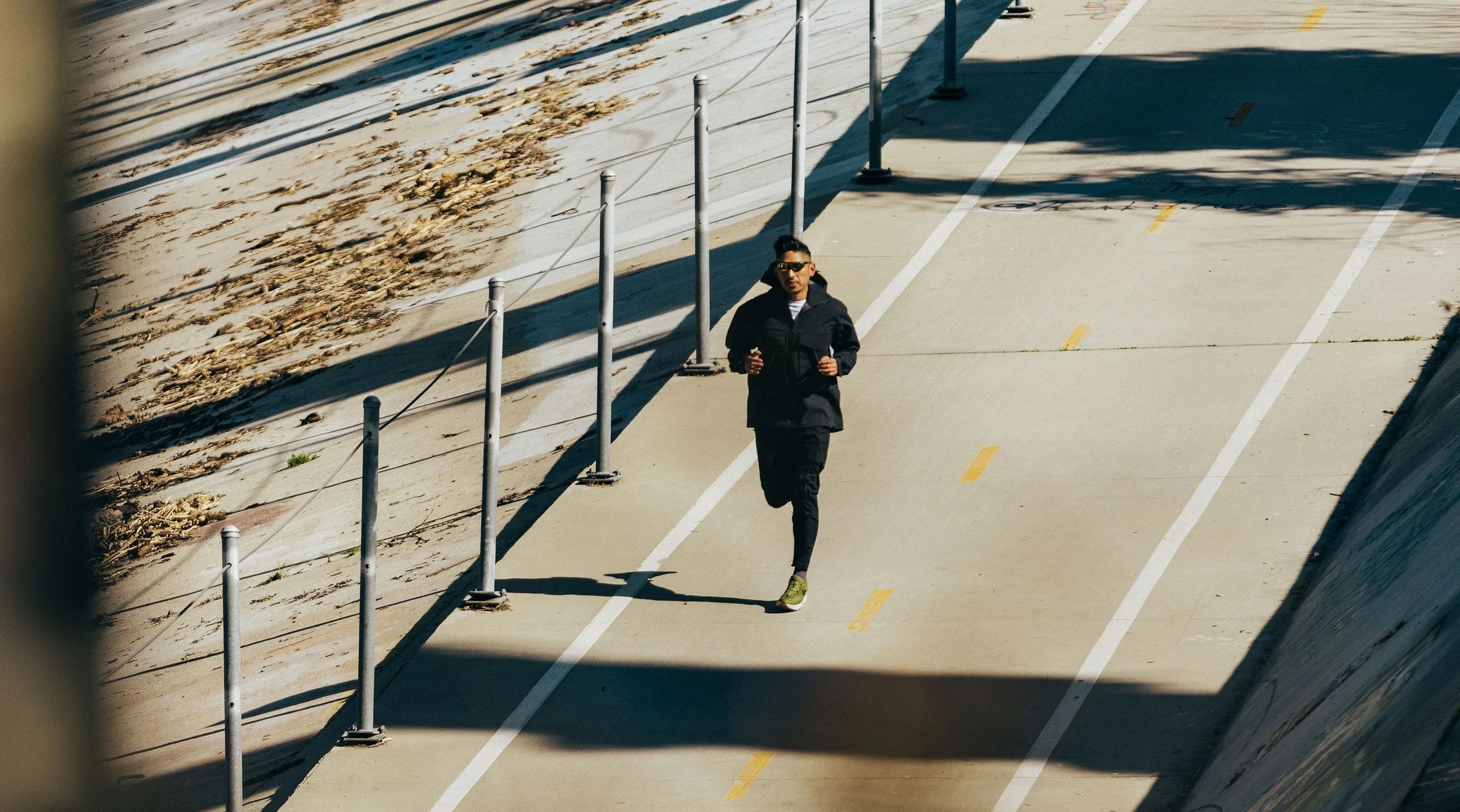 ja tecson jogging wearing hoka transport sneakers