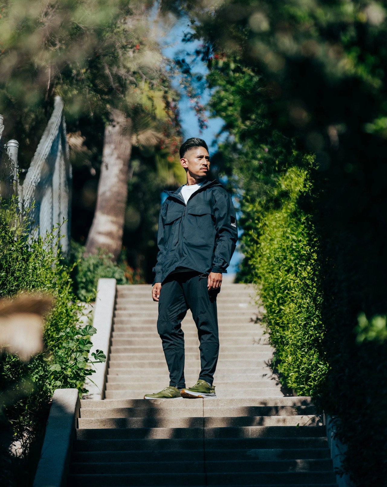 ja tecson wearing hoka transport sneakers