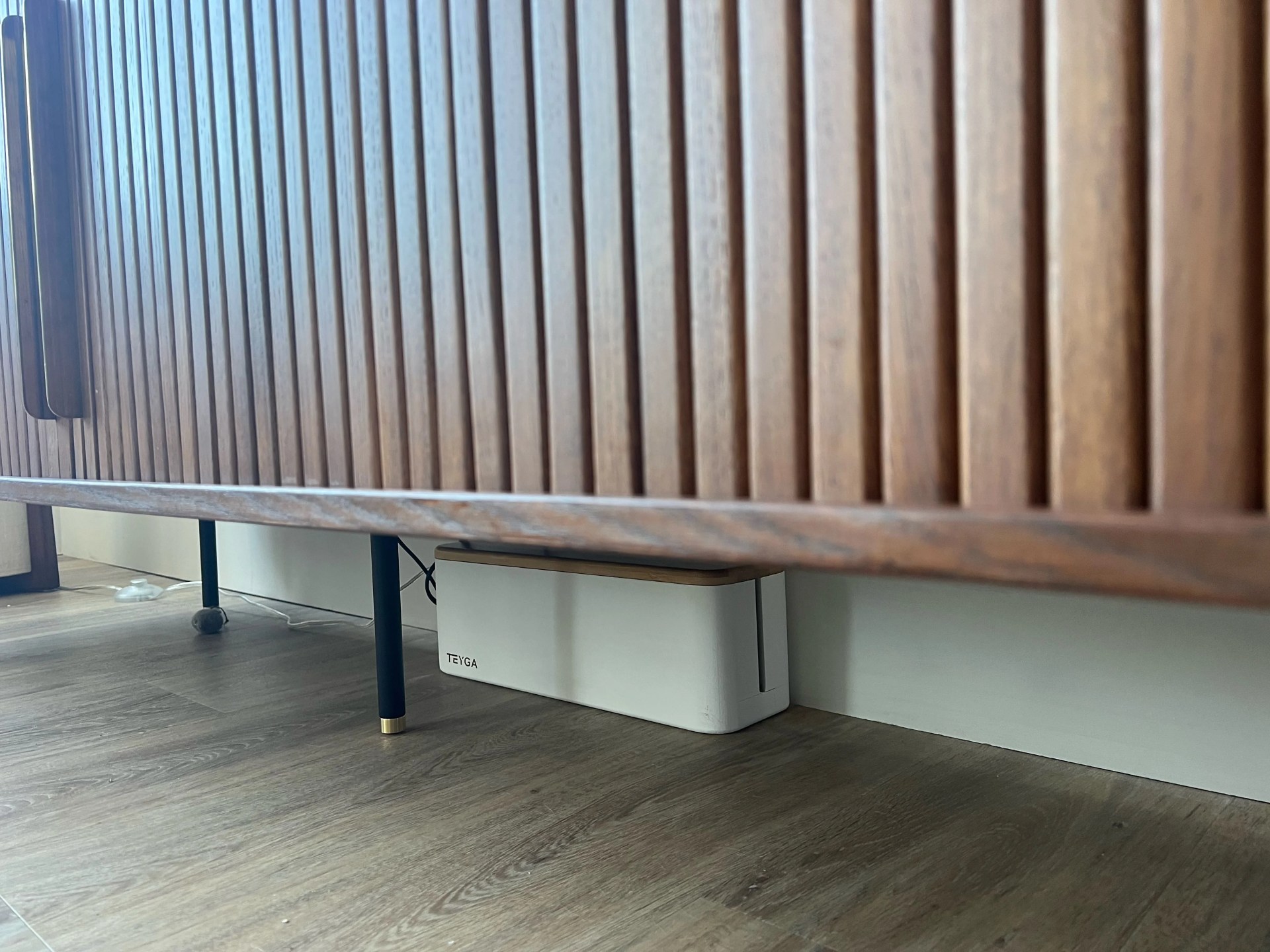teyga device ynder a wooden cabinet