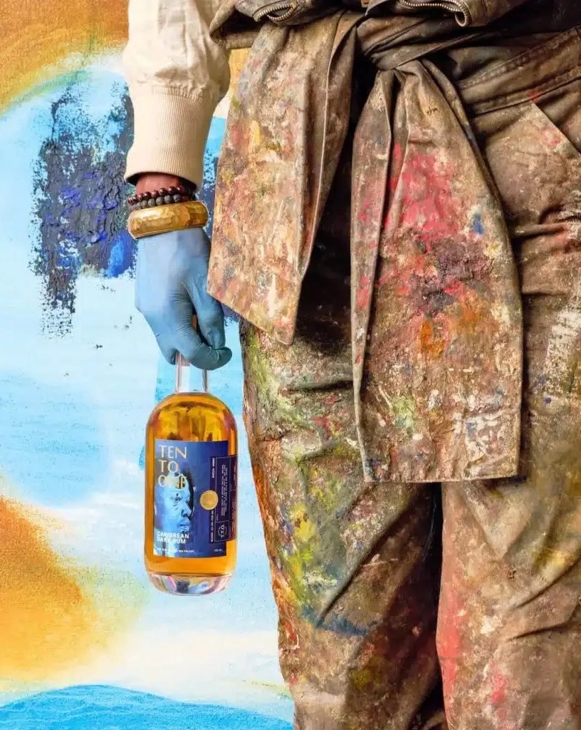 devin b johnson holding ten to one black history month artist edition caribbean dark rum 86 proof