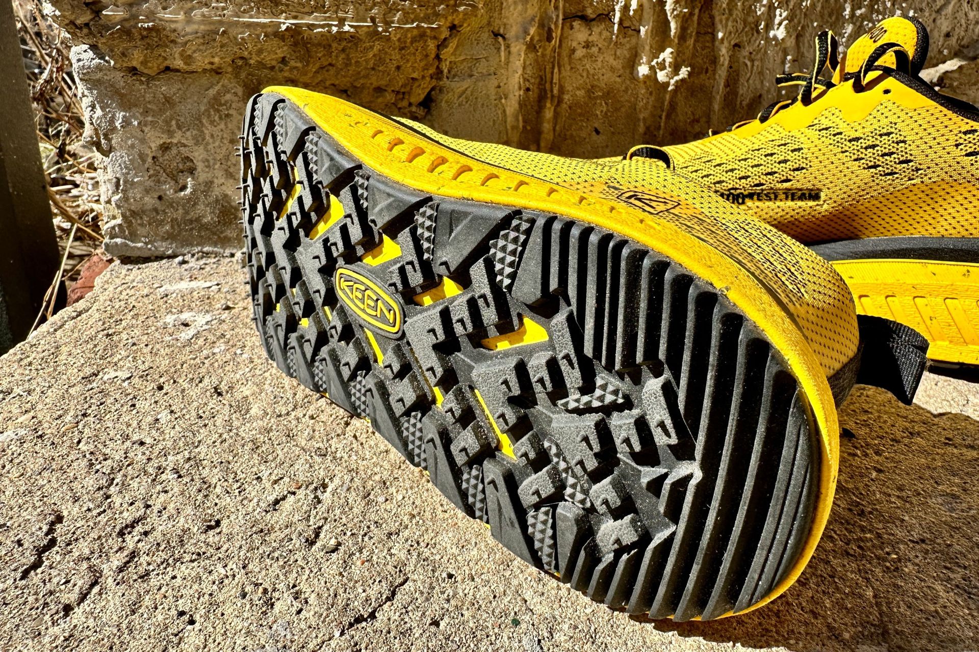 the underside of a keen wk500 shoe lying on a sidewalk