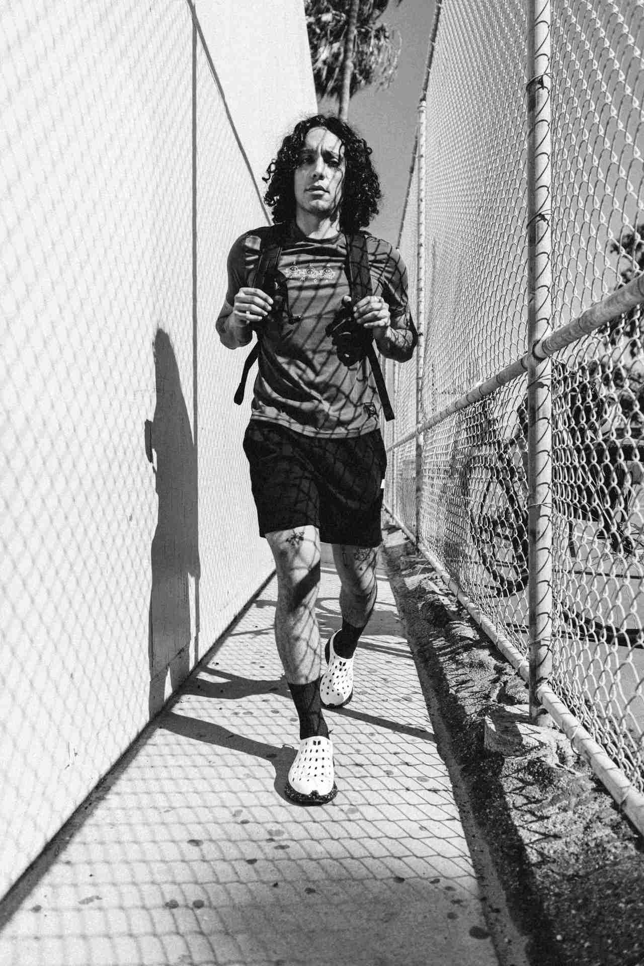 black and white image of man walking
