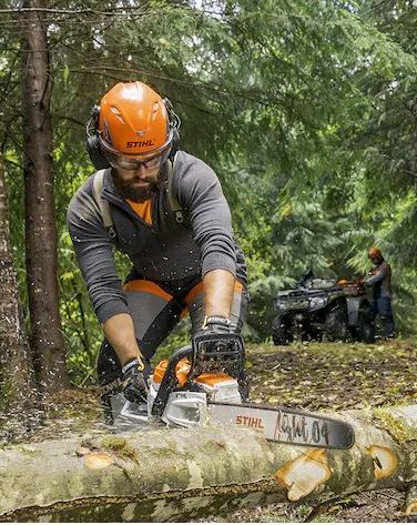 man using stihl msa 300 c o chainsaw