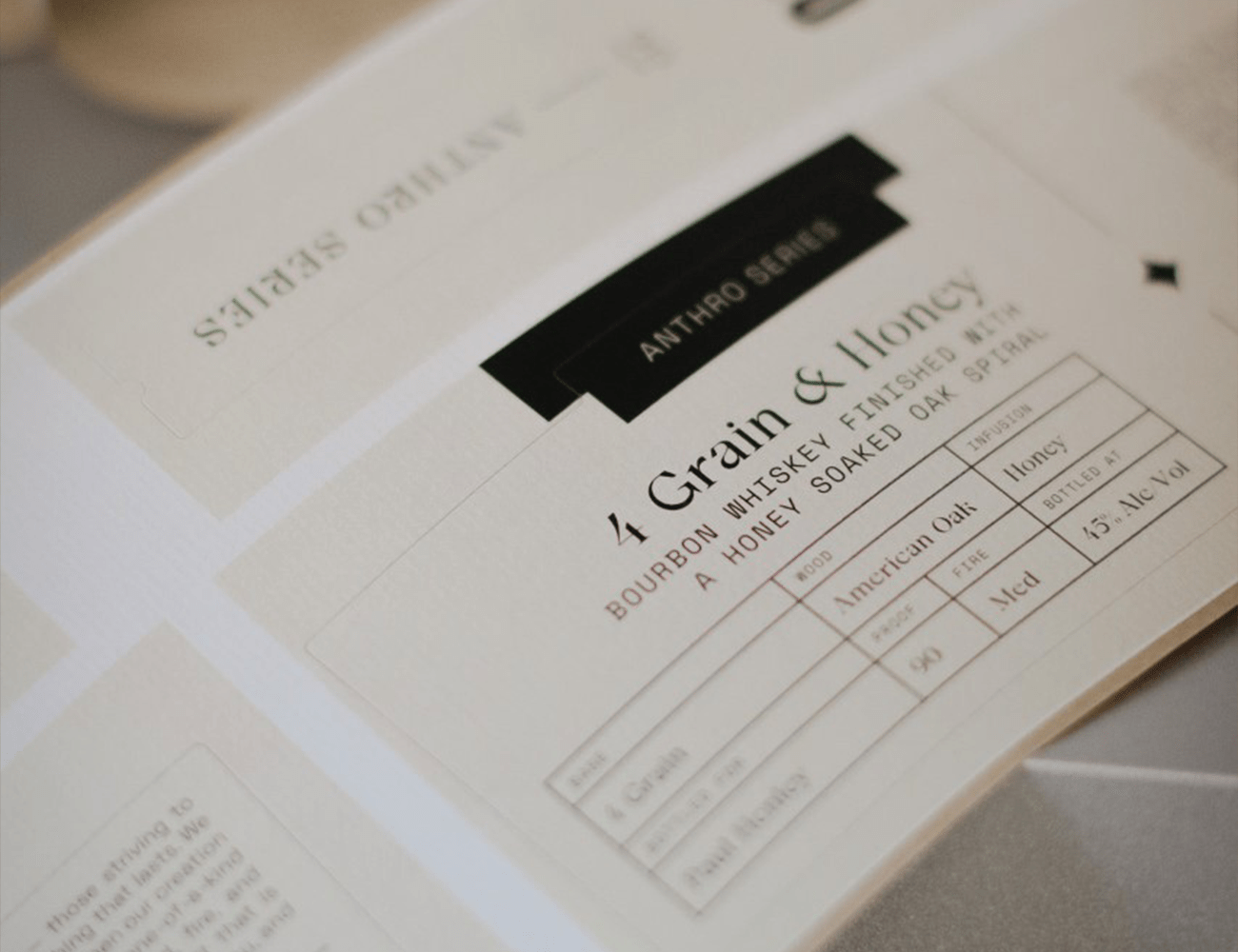 a close up shot of a white label that says grain and honey