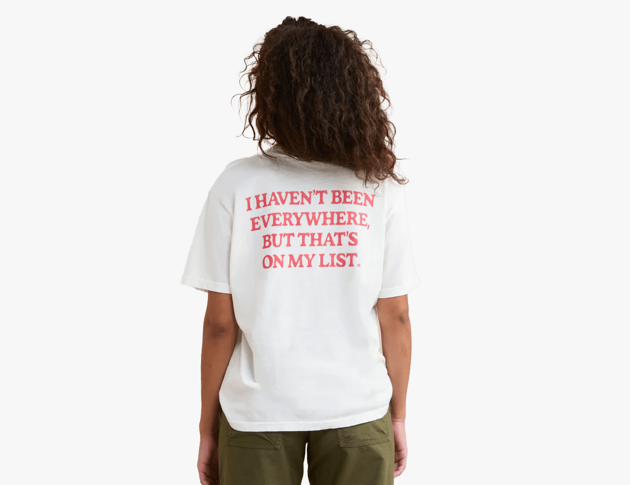 a woman wearing a tshirts that reads i havent been everywhere but thats on my list on the back