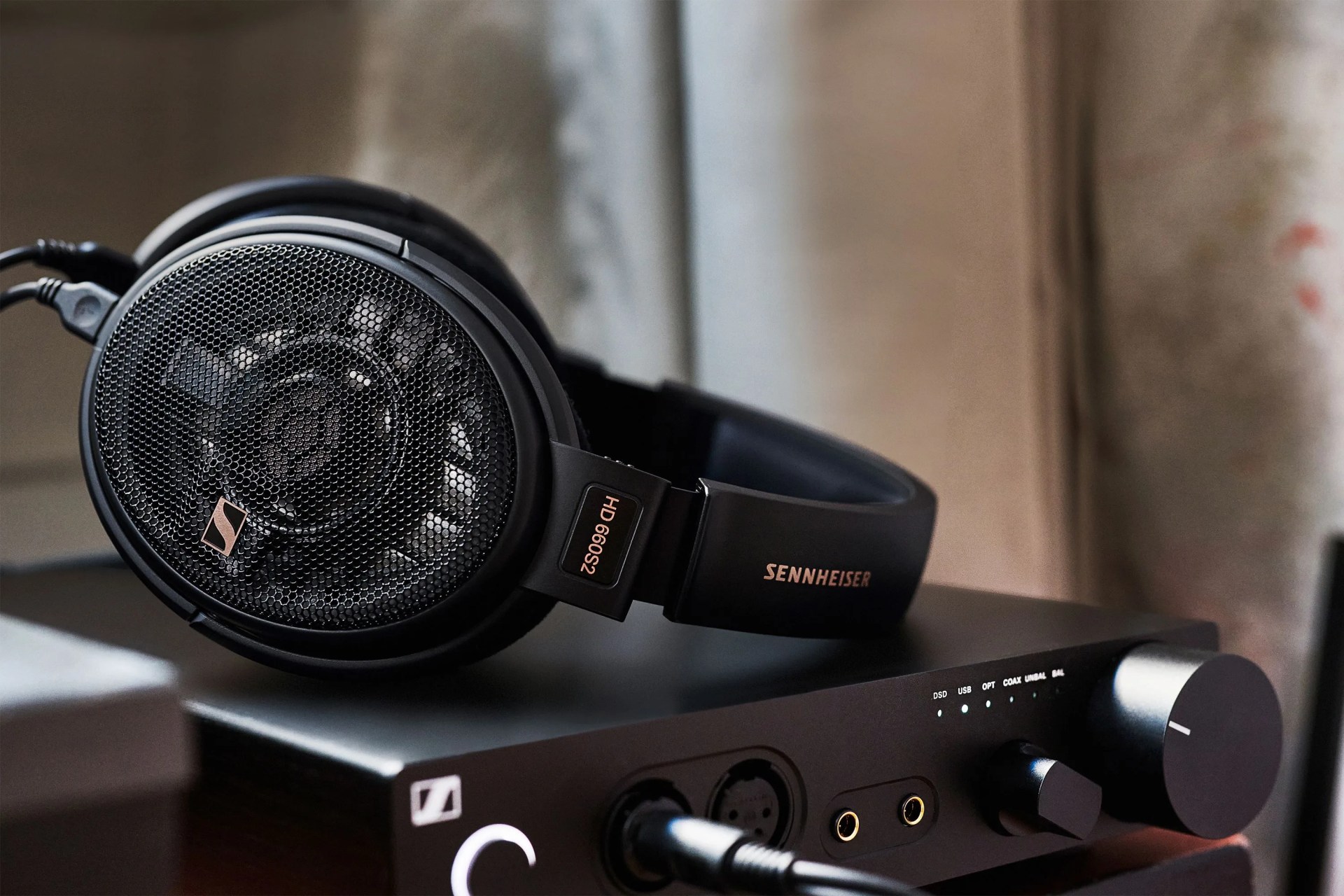 headphones sitting on a stereo system