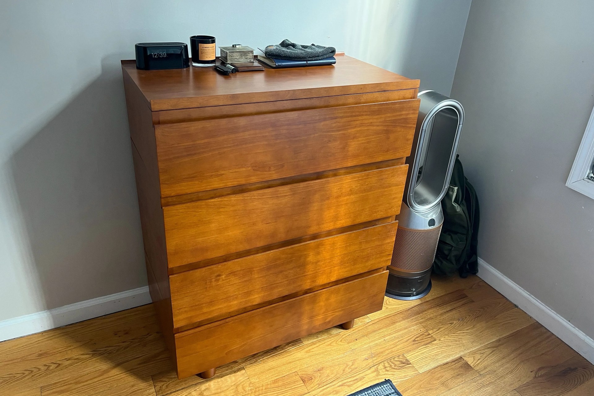 thuma dresser in a bedroom next to a dyson air purifier