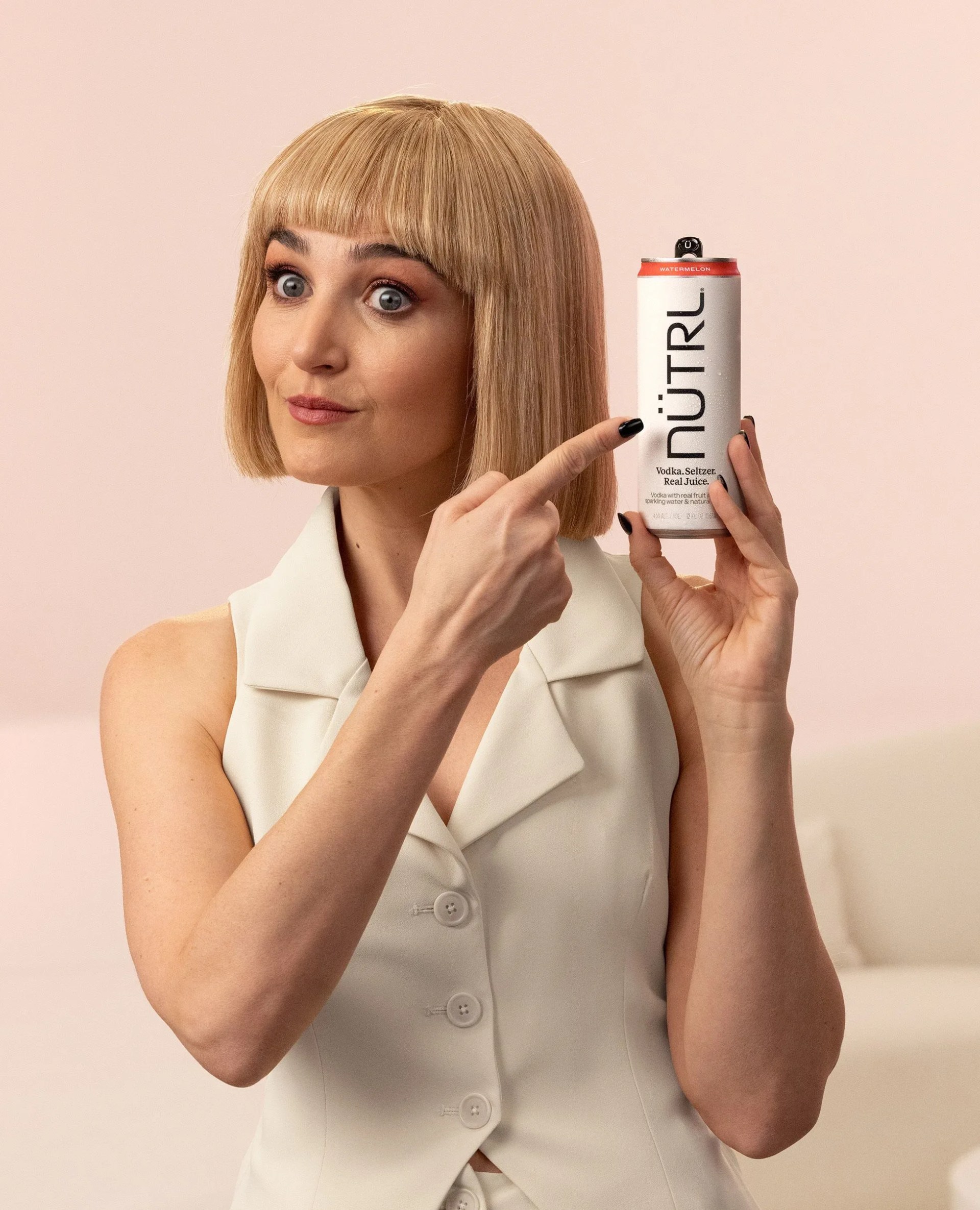 chloe fineman with a nutrl vodka can