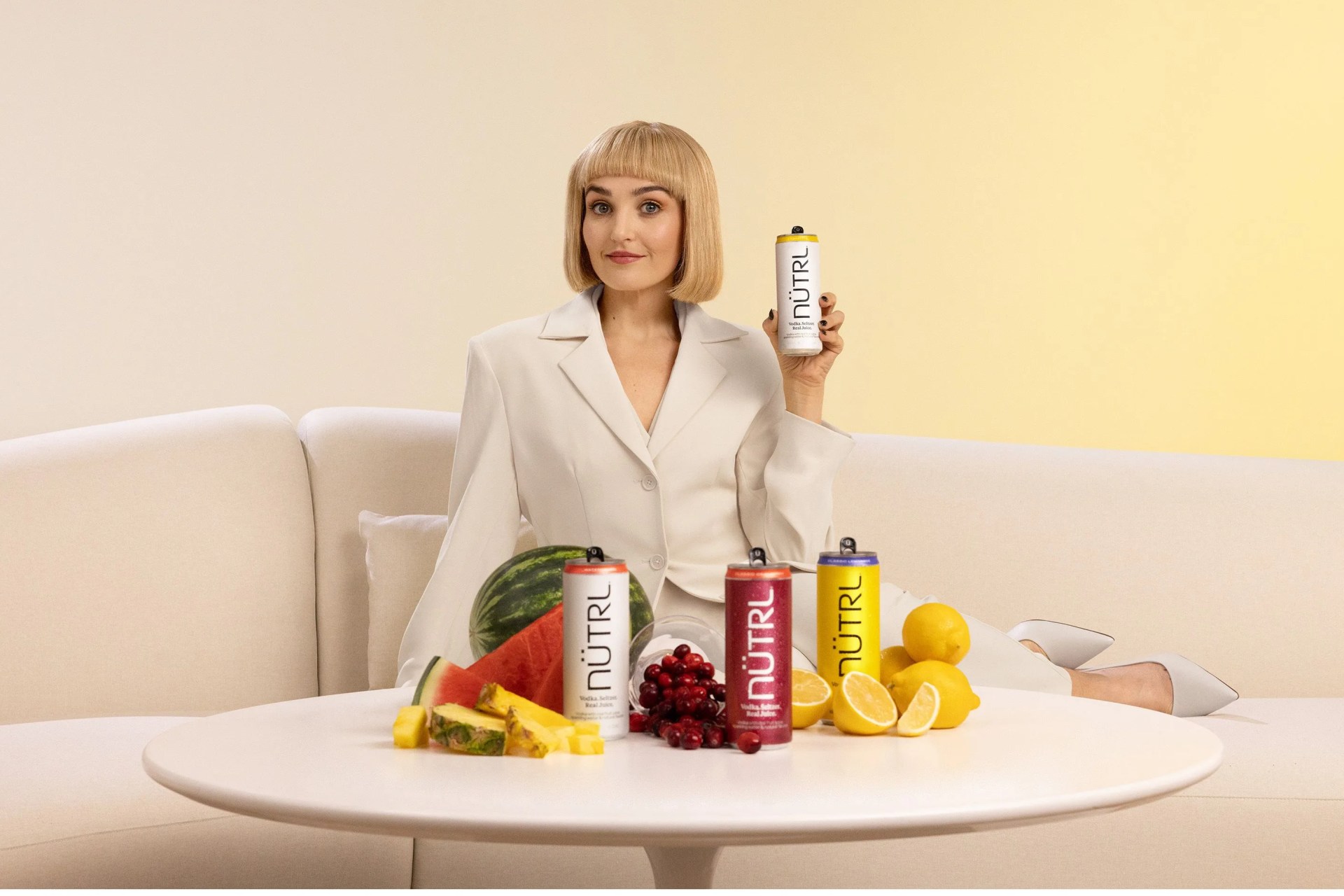 chloe fineman with a nutrl vodka can