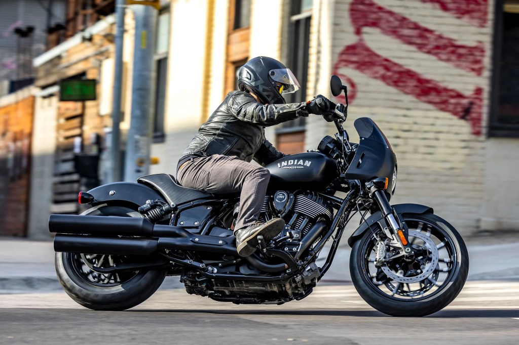 a man riding a 2023 indian sport chief motorcycle