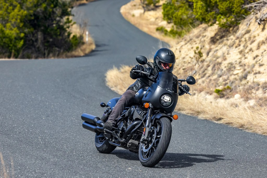 a man riding a 2023 indian sport chief motorcycle