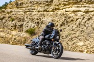 a man riding a 2023 indian sport chief motorcycle