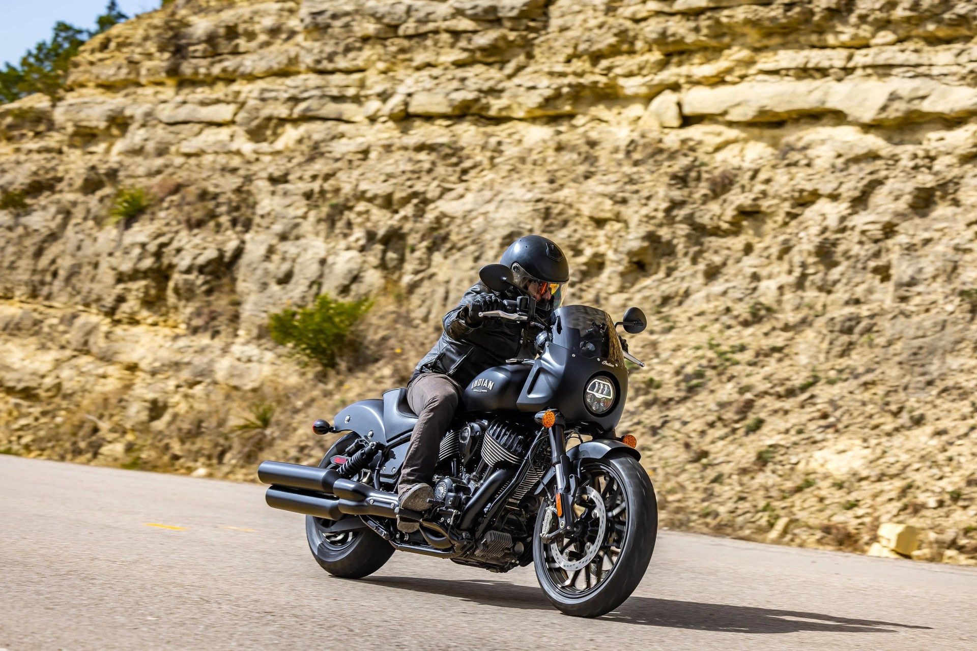 a man riding a 2023 indian sport chief motorcycle