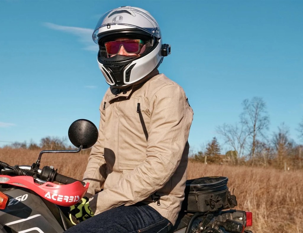 a man sitting on a motorcycle