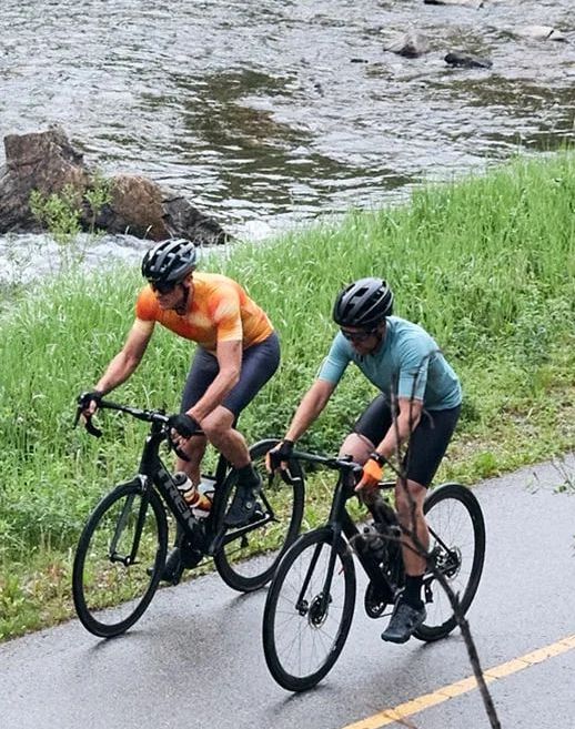 two men biking wearing pearl izumi gear