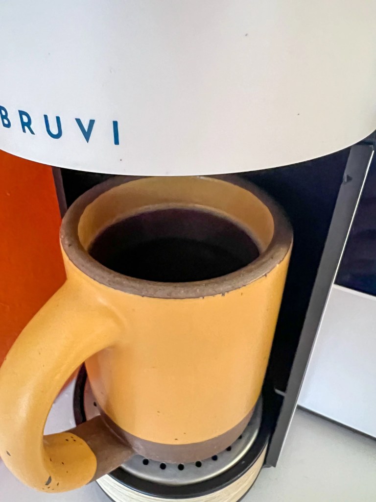 a coffee cup in a bruvi coffee maker
