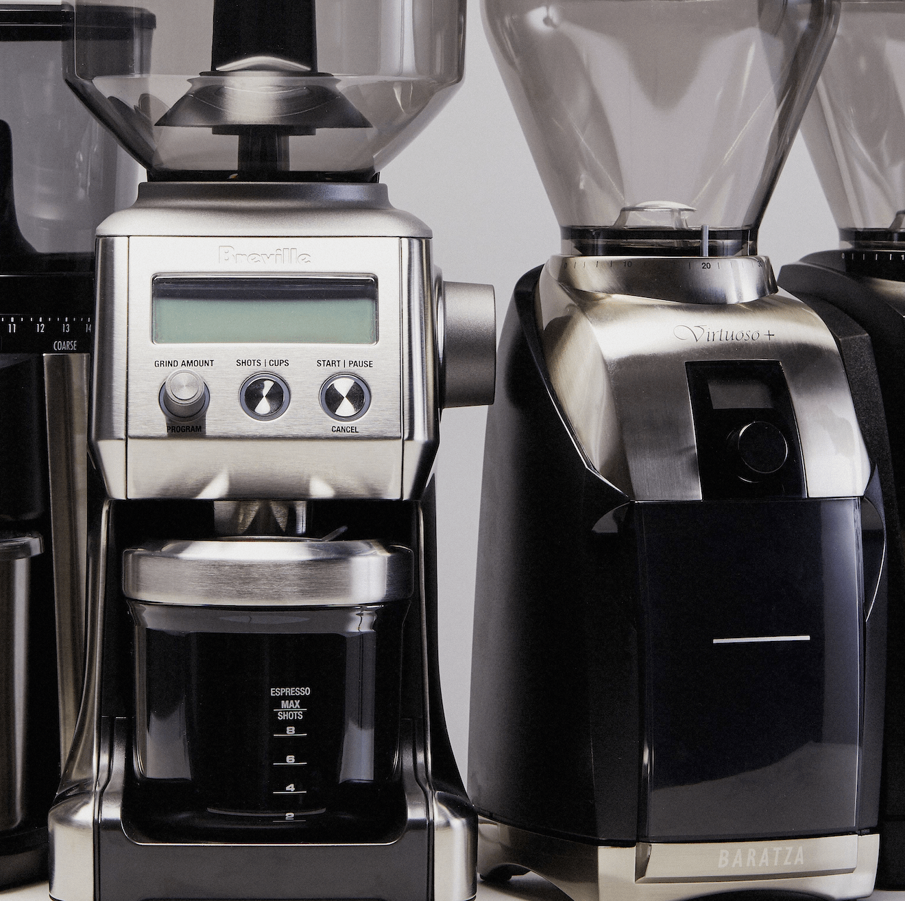 four coffee grinders side by side