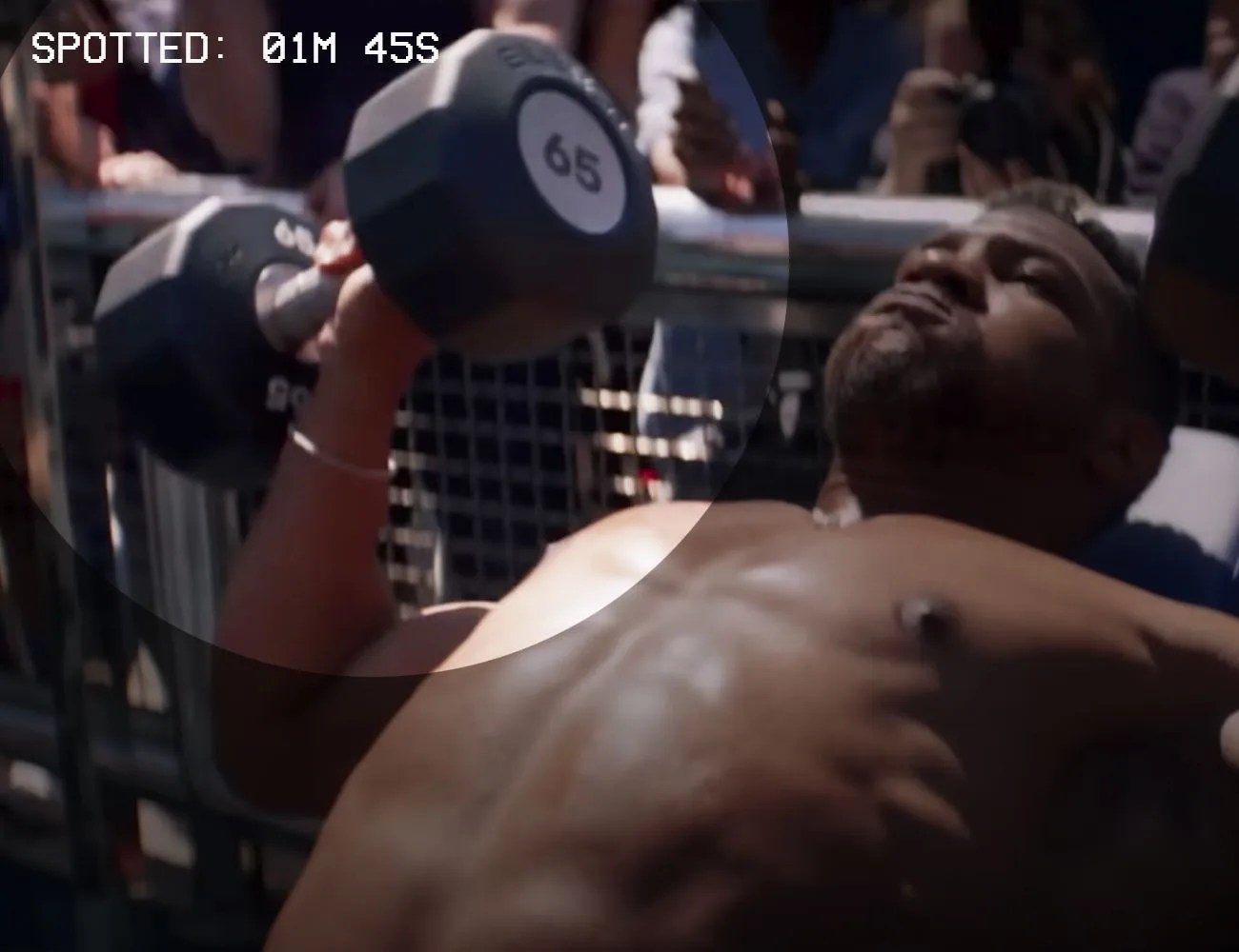 a man on a weightlifting bench doing a bench press with black dumbbells