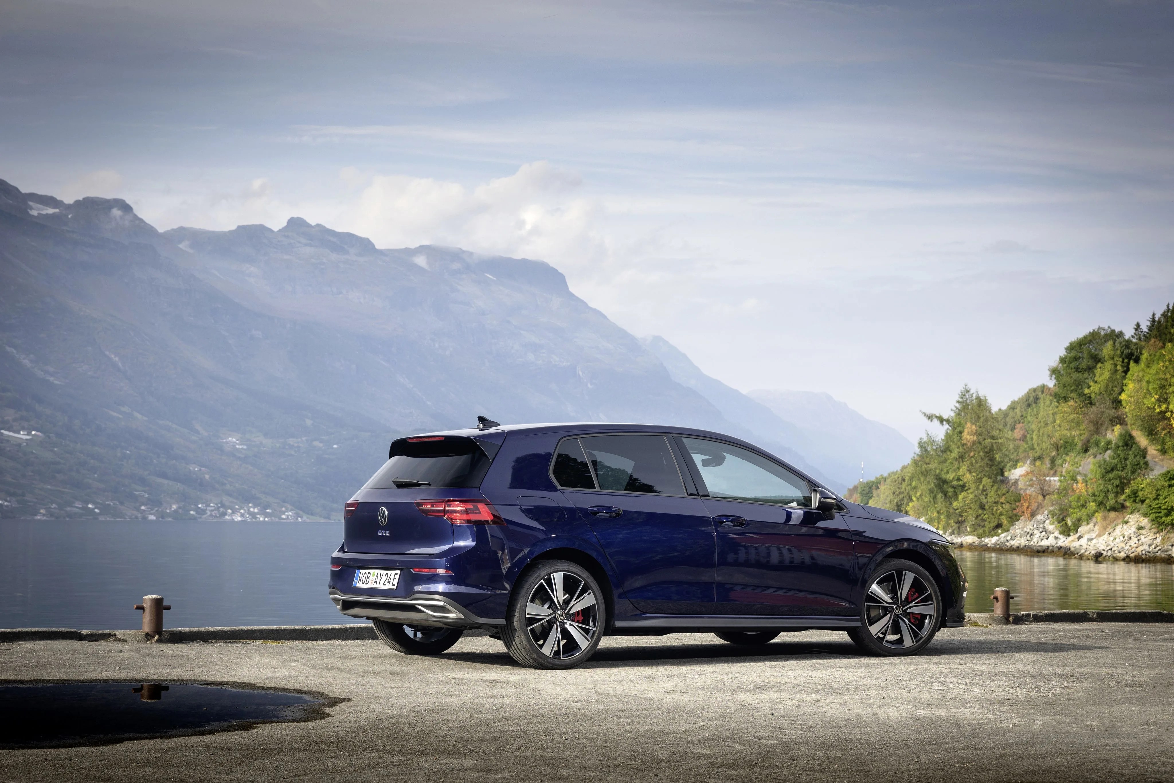 vw golf parked by a lake