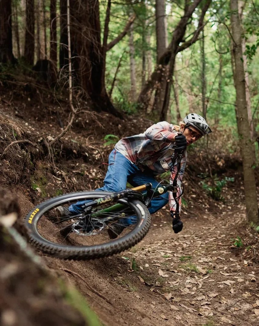 man wearing ripton and co bike pants while biking down dirt trail