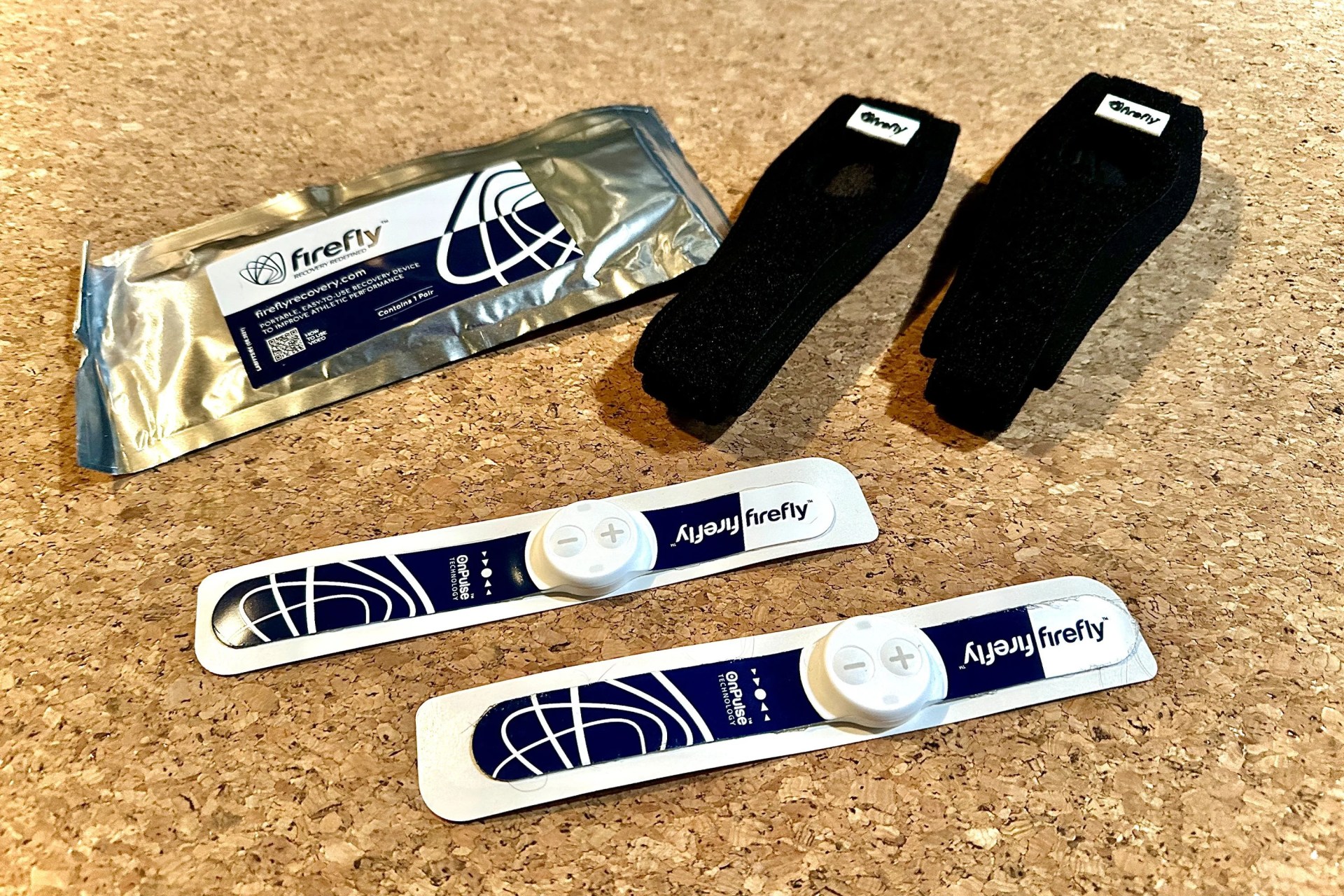 a firefly portable recovery device on a workout mat