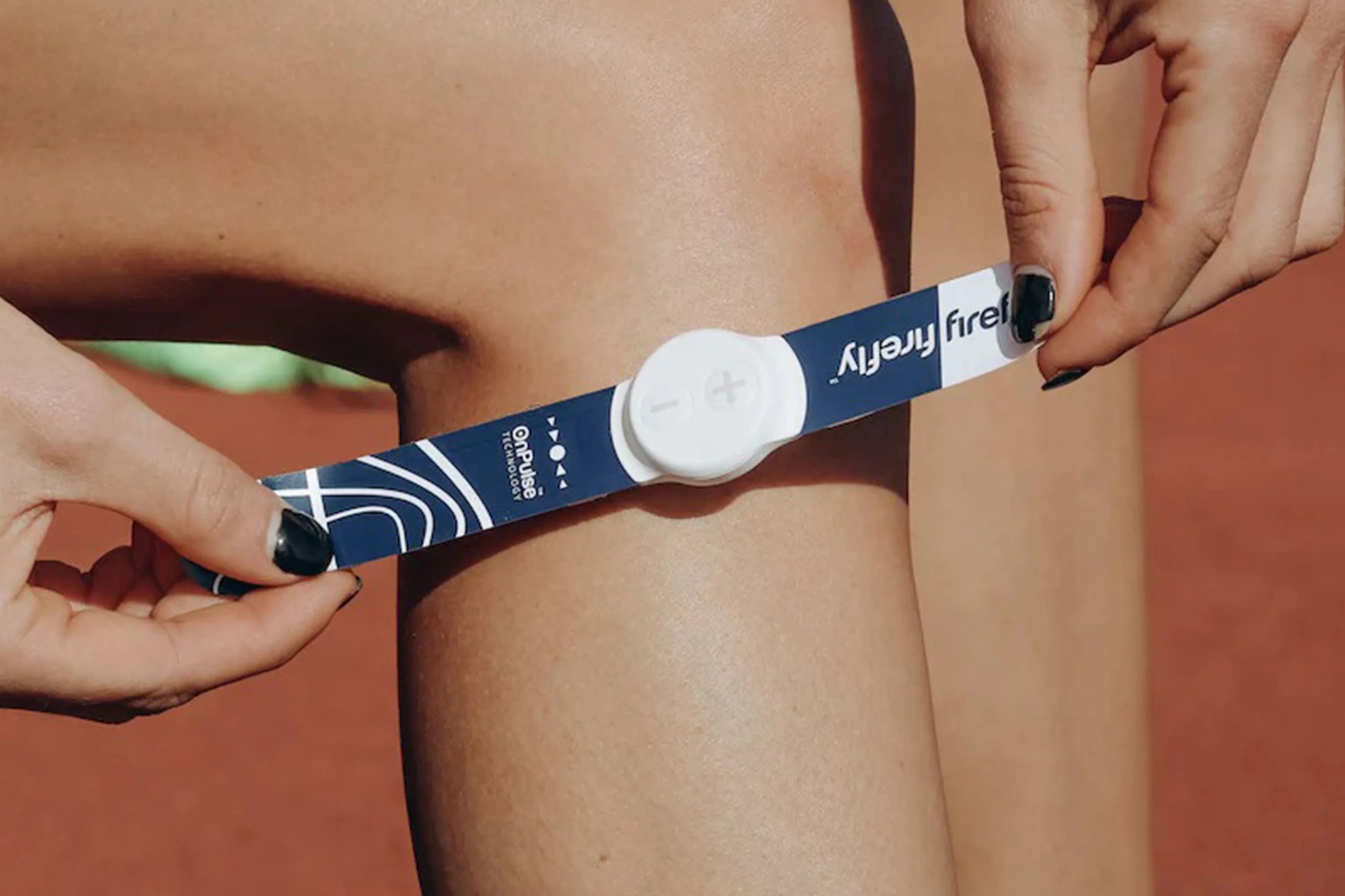 a person putting on a firefly portable recovery device on their leg