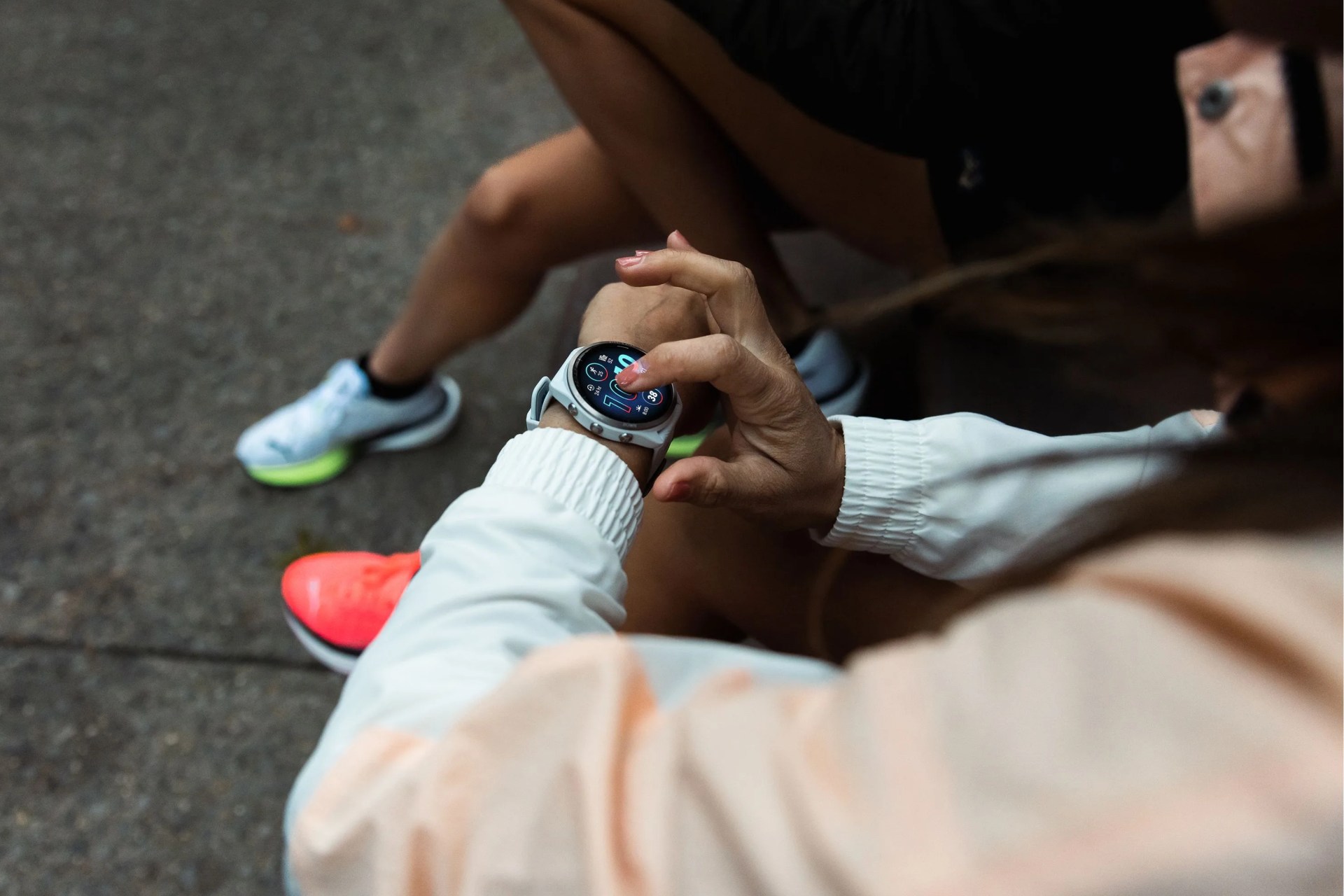 a person using the touchscreen on a garmin watch