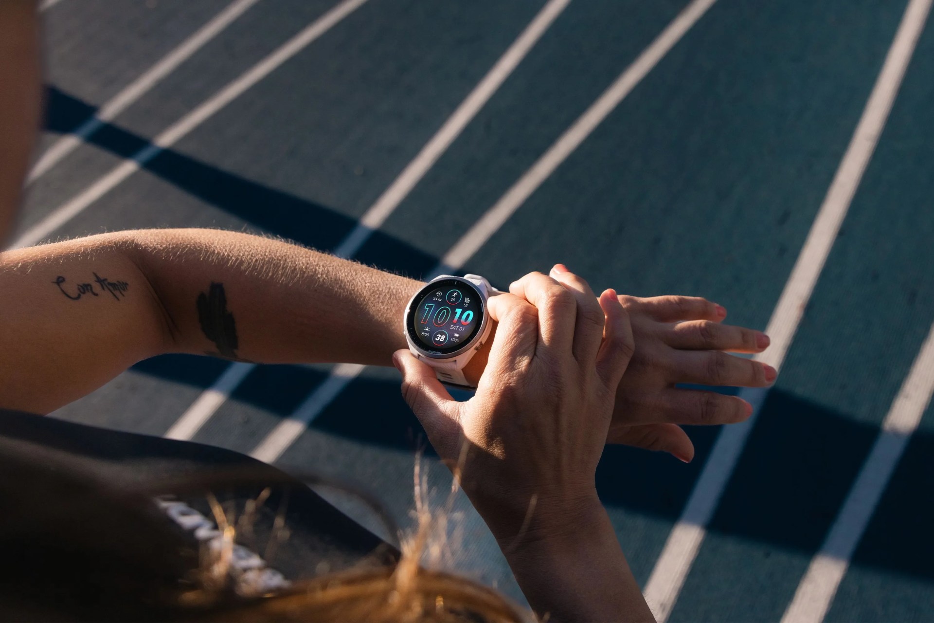 a person wearing a garmin watch