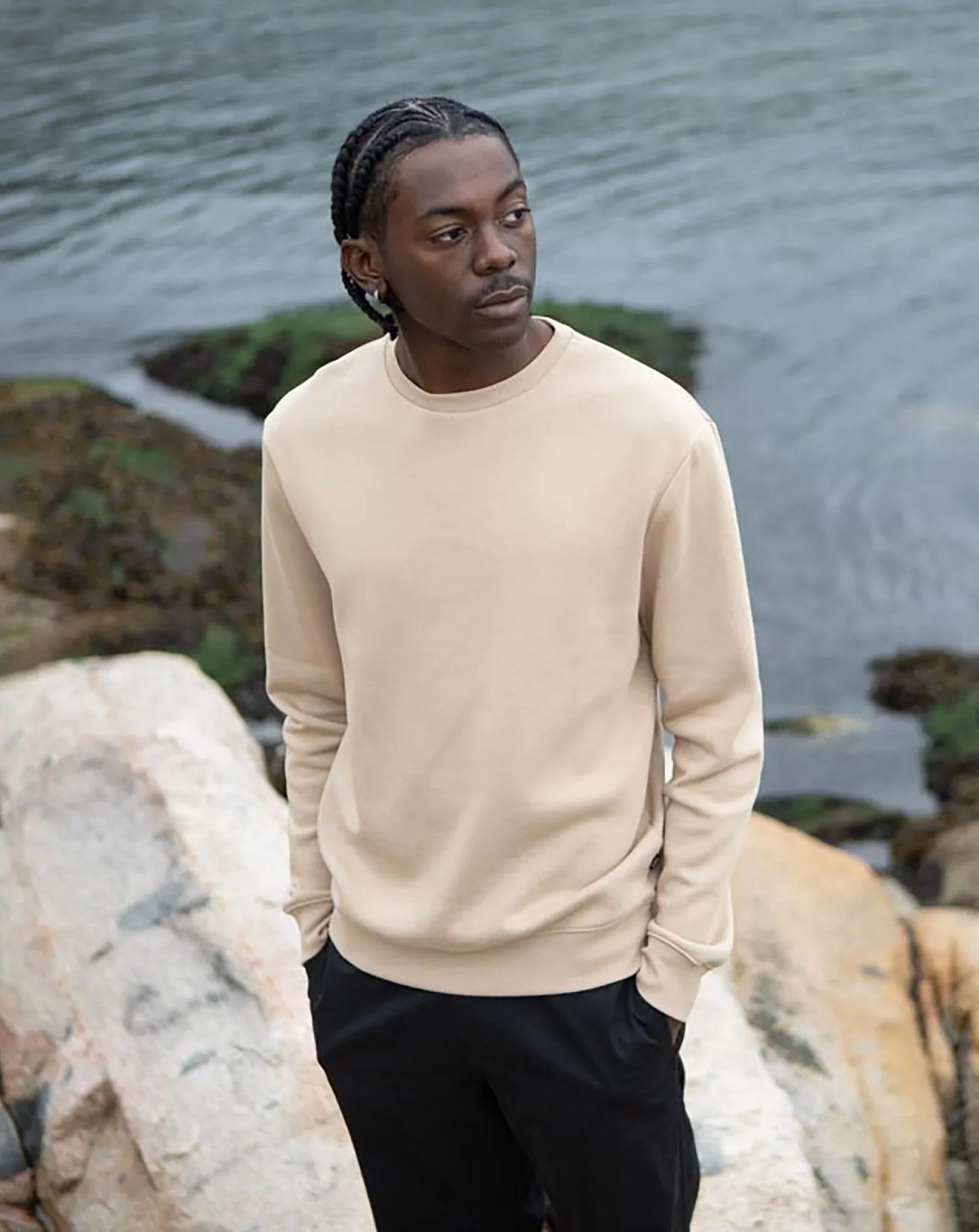 man wearing tentree ocean collection sweater in beige