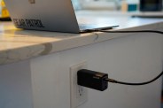 a laptop being charged on a counter