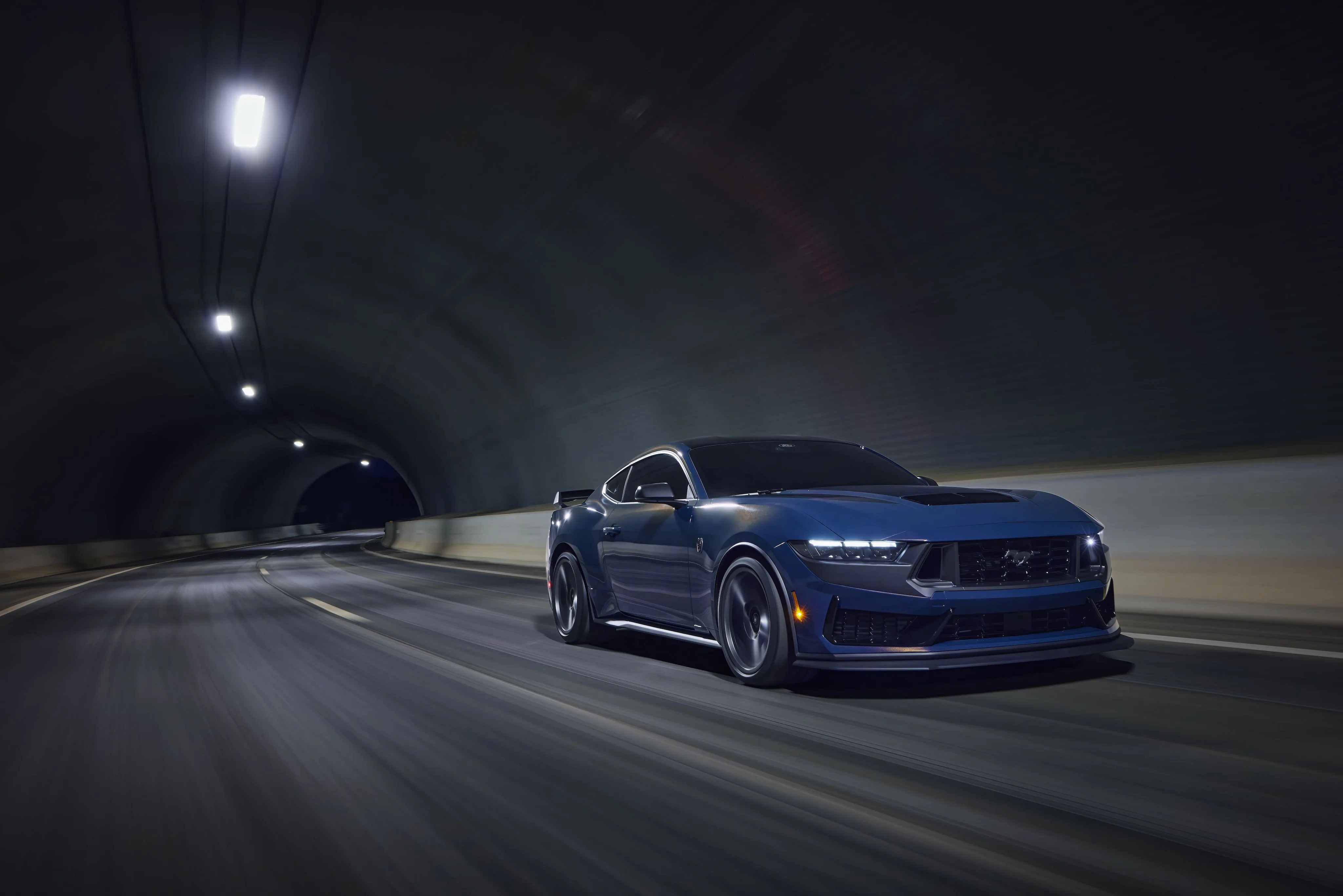 with sinister looks and a specially modified 50 liter v8 – the most powerful 50 liter v8 ever, projecting 500 horsepower – dark horse expands the mustang lineup and sets a new benchmark for american street and track performance that could only come in a mustang pre production vehicles shown closed course professional driver