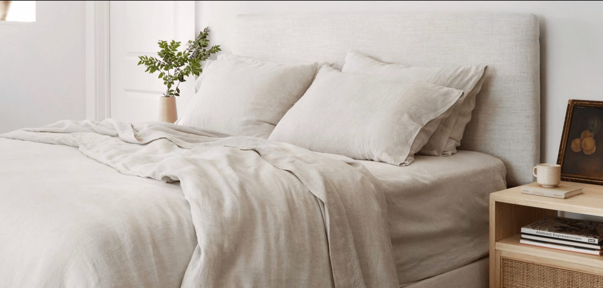 bed made with linen bedding