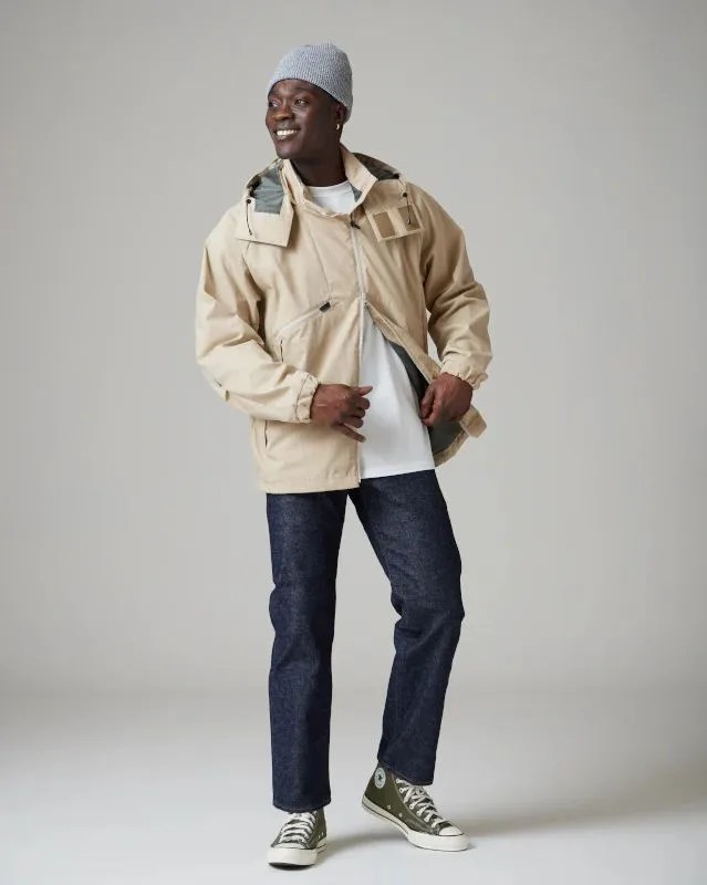 man posing wearing snow peak ss2023 fire resistant stretch jacket