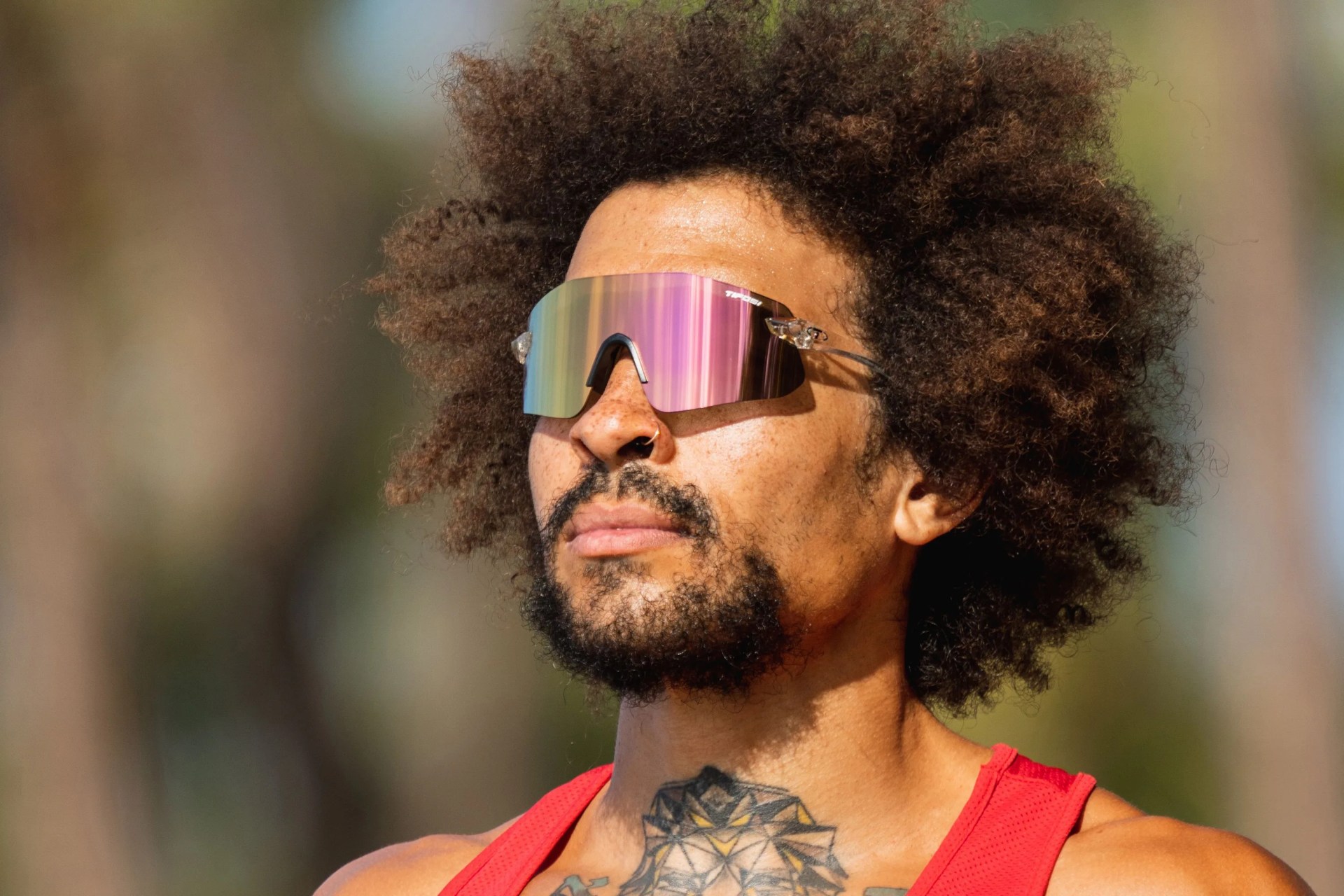 a man wearing tifosi sunglasses