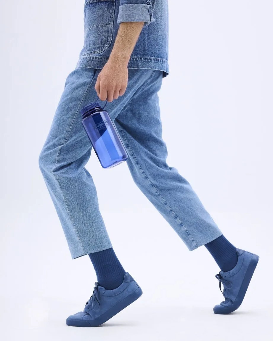 person holding nalgene bottle in denim blue