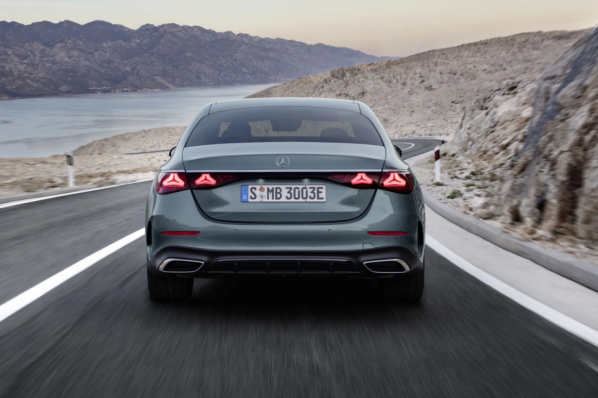 new mercedes benz e class driving on a desert road