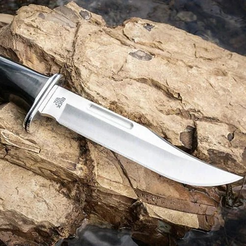 a large knife on a rock