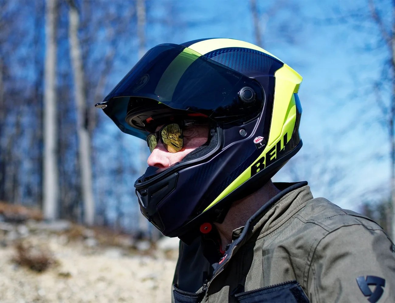 a man on a motorcycle looking back at the camera