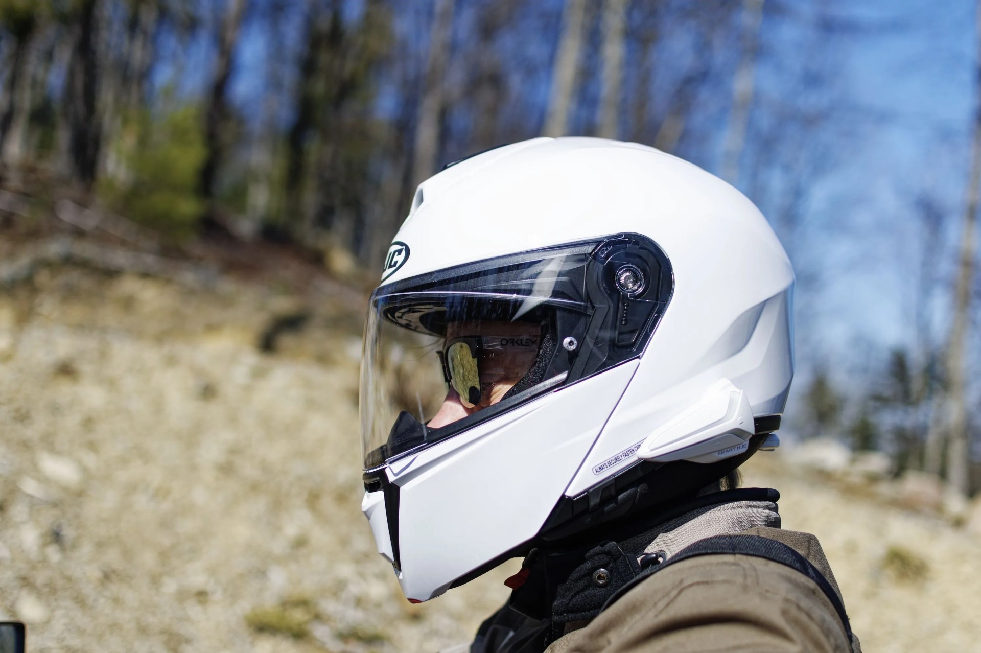 a man wearing a white motorcycle helmet