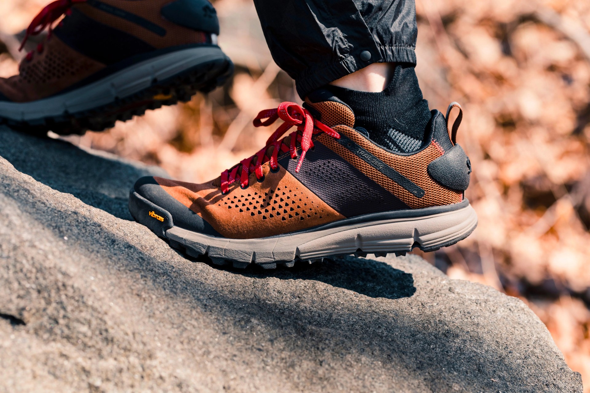 a close up of a hiking boot on a rock